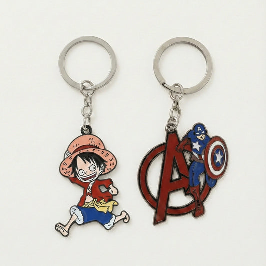 Two keychains featuring a character in a red hat and another with a superhero design on a white background.