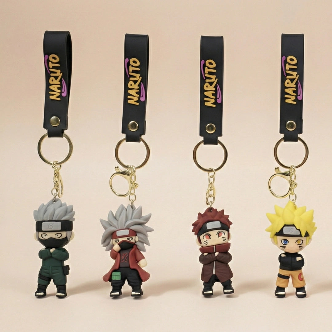 Four Naruto-themed keychains on a beige background