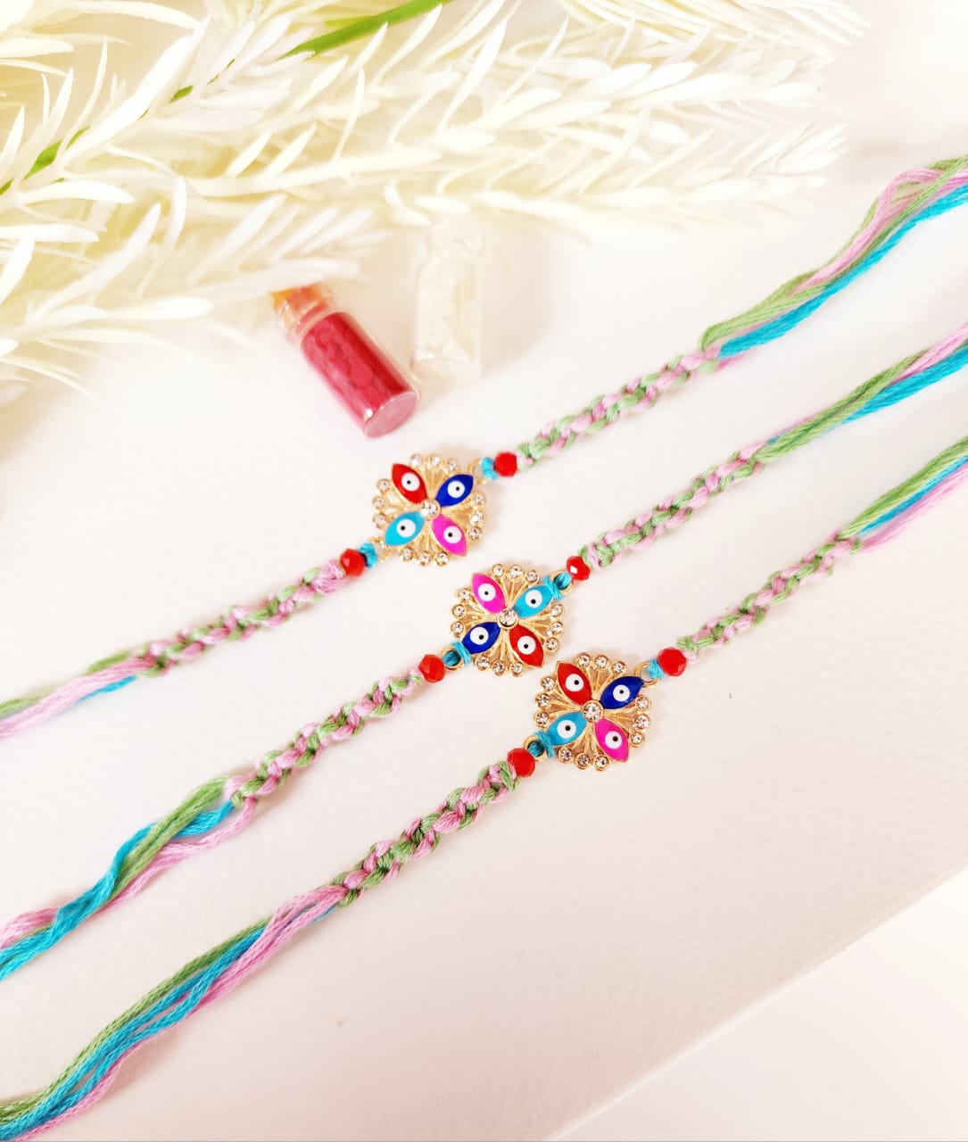 Decorative bracelets with colorful beads on a light background