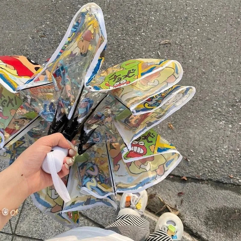 Colorful toy windmill with cartoon designs on a concrete surface