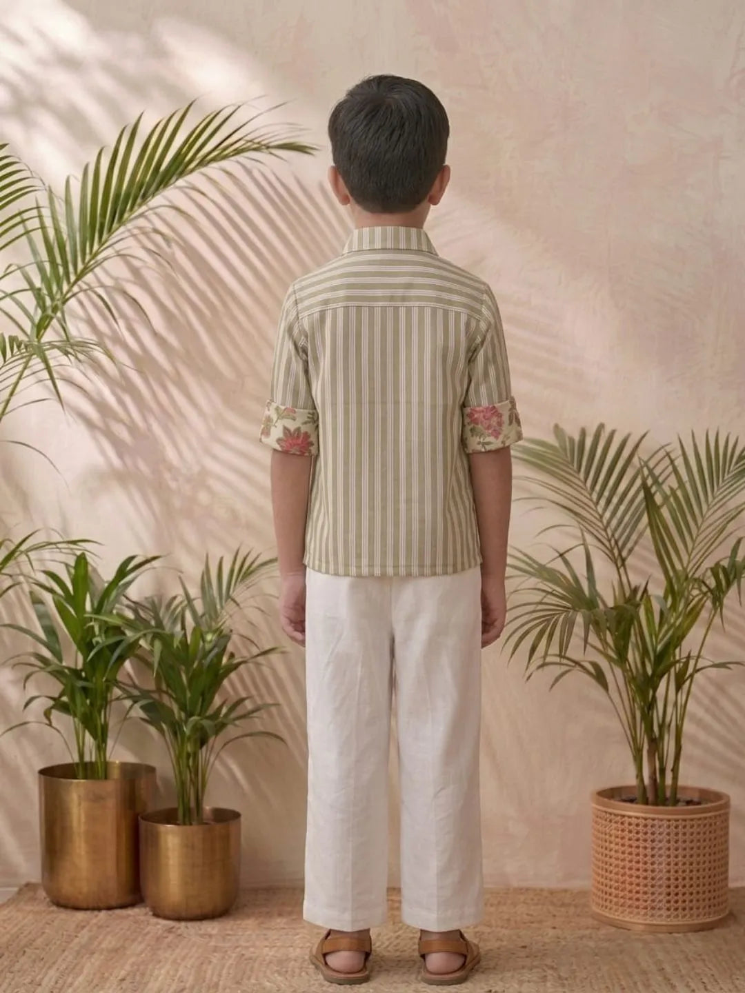 Boys olive striped shirt and white trouser outfit back view