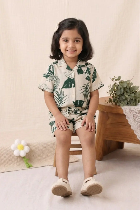 Girl wearing cotton printed co-ord set sitting pose front view kids outfit