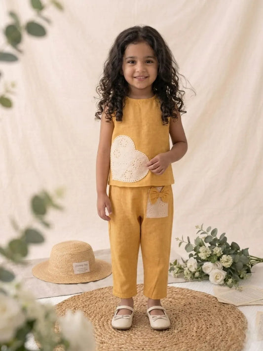 Girls yellow cotton co-ord set with heart applique front view sleeveless top and pants