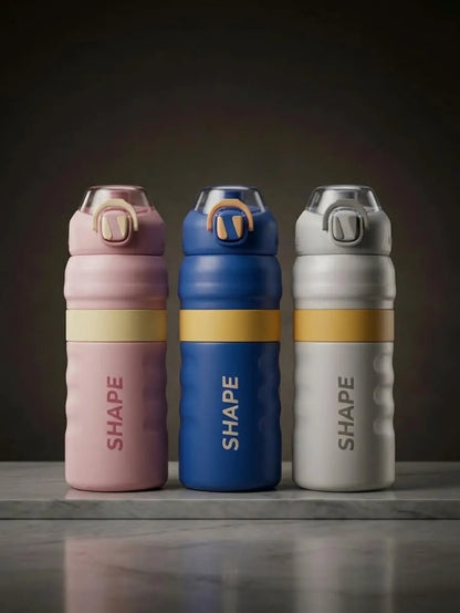 Three reusable water bottles with the brand name 'SHAPE' printed vertically, shown in pink, blue, and white colorways with yellow bands, set against a dark studio background.