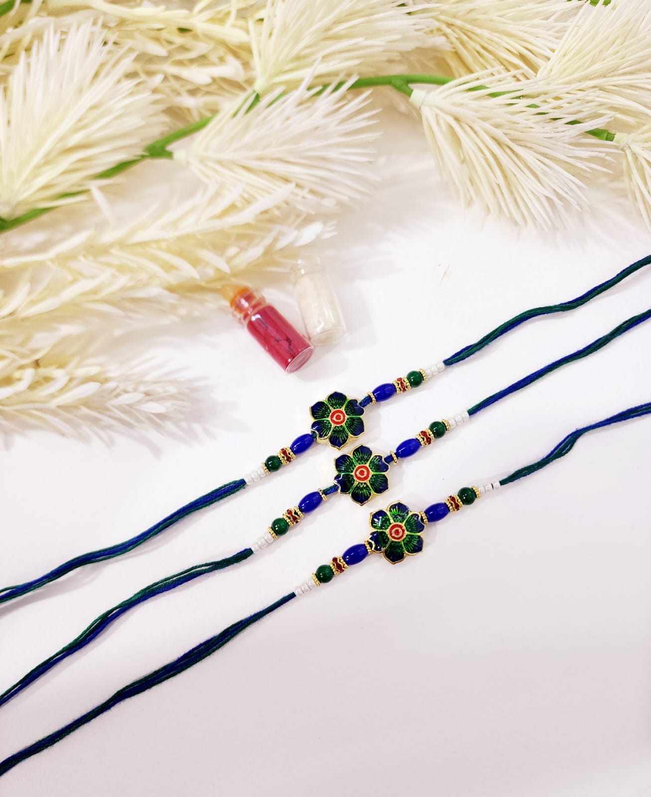 Three decorative hairbands with floral designs on a white background