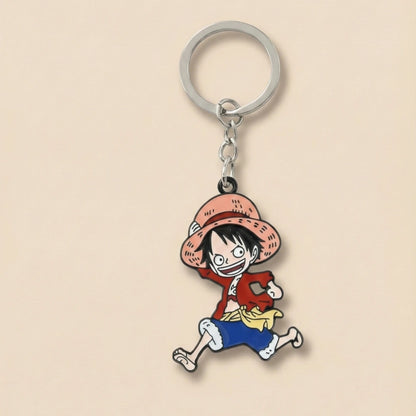 Keychain with a cartoon character in a red jacket and straw hat on a beige background