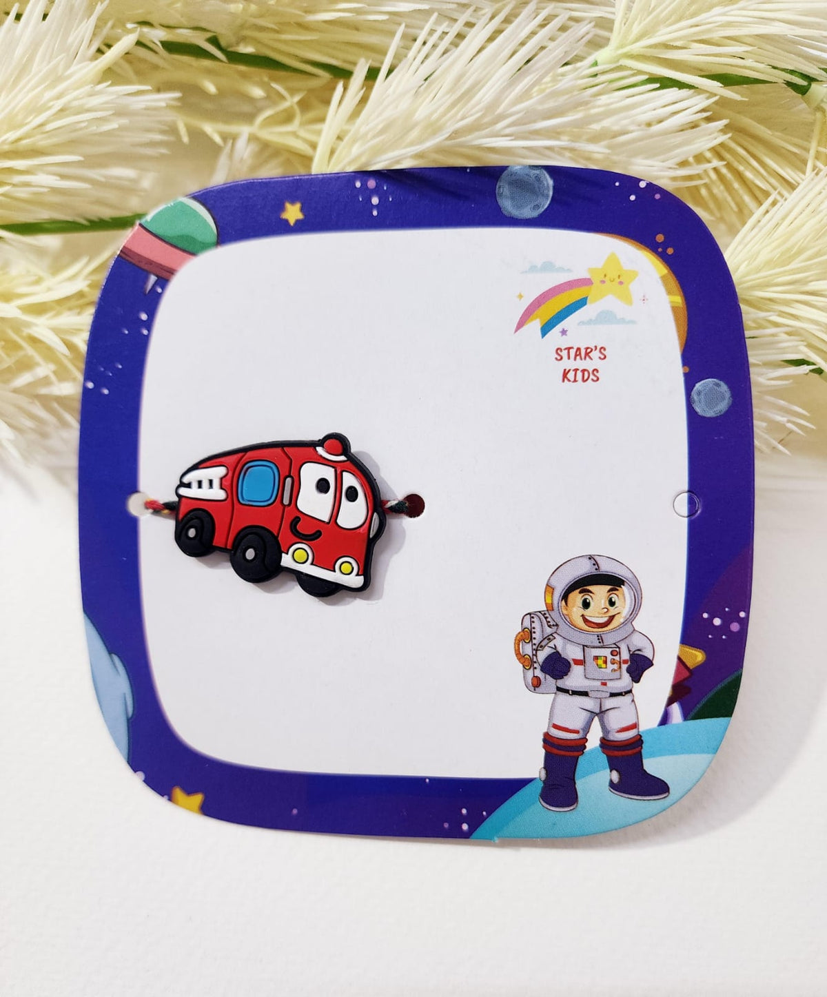 Children's plate with cartoon fire truck and astronaut design on a white background