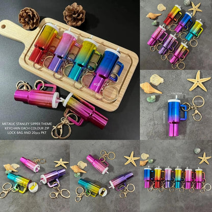 Colorful keychains on a wooden board with starfish and shells on a gray background