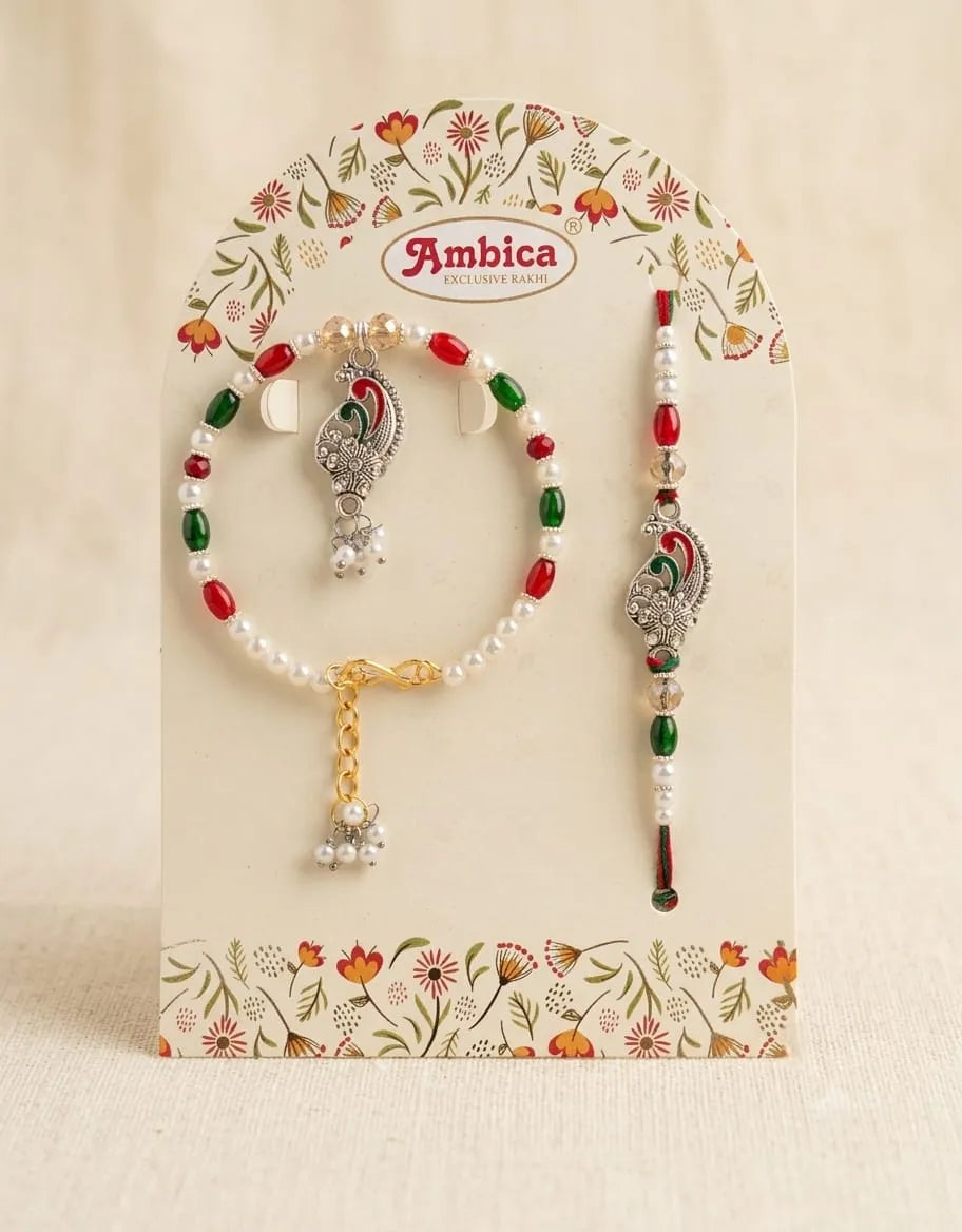 Jewelry set with beads and decorative elements on a floral Ambica branded card.