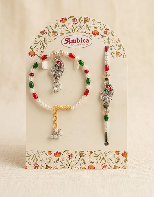Jewelry set with beads and decorative elements on a floral Ambica branded card.