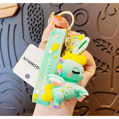 Dragonrun keychain held by a hand with a decorative background