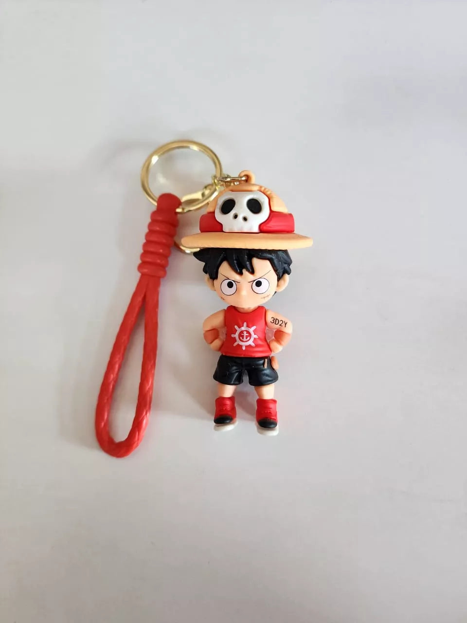 Keychain with a character wearing a red hat and shirt on a white background