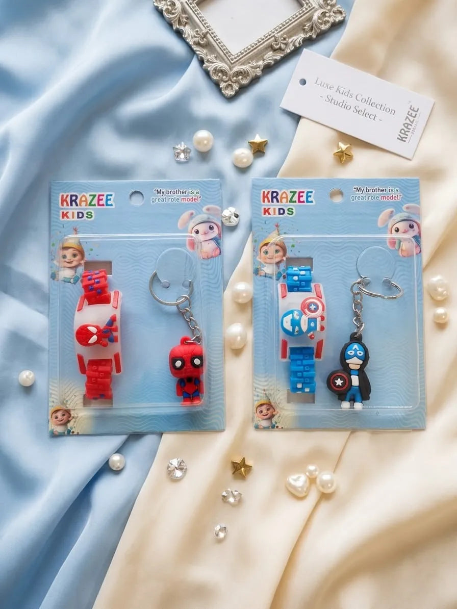 Two packaged KRAZEE KIDS wrist watch keychains displayed on a soft blue and cream fabric background with decorative pearls and stars. One set features a red Spider-Man-themed watch and keychain, and the other features a blue and white astronaut-themed watch and keychain.
