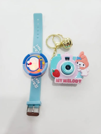 A light blue silicone watch and a matching camera-shaped charm keychain, both featuring cartoon character designs and 'MY MELODY' text, displayed on a plain white background.