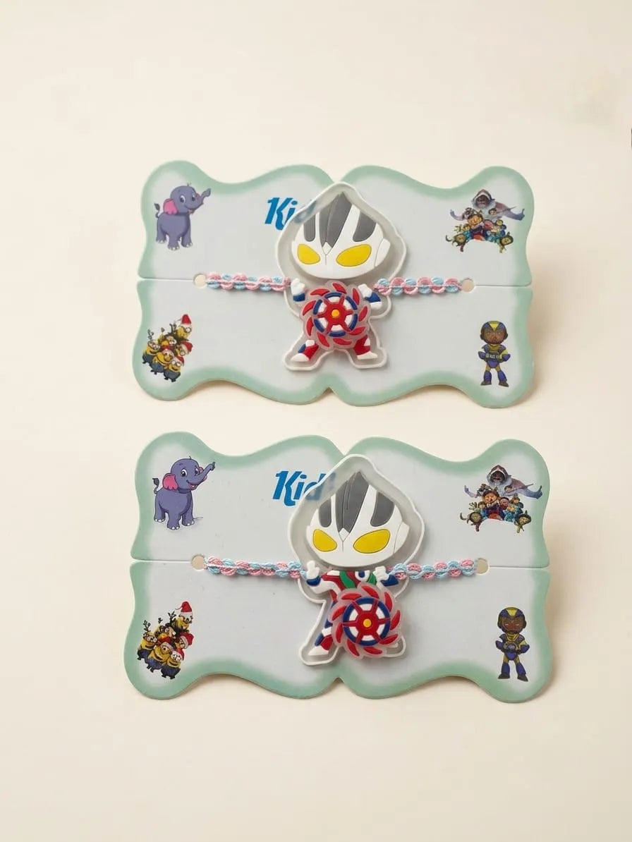 Two matching chibi Ultraman wristlets with colorful braided cords, displayed on their mint green illustrated backing cards against a light beige background.
