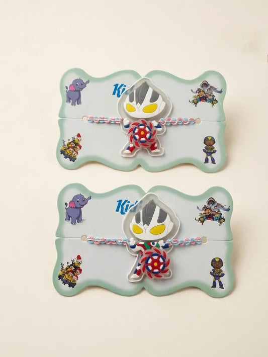 Two matching chibi Ultraman wristlets with colorful braided cords, displayed on their mint green illustrated backing cards against a light beige background.