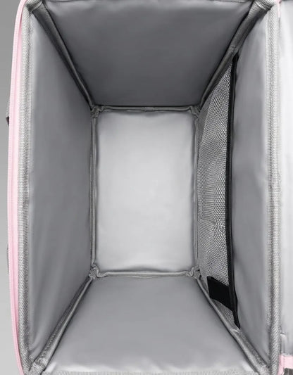 Gray pet carrier with a pink trim, showing the interior and mesh sides.