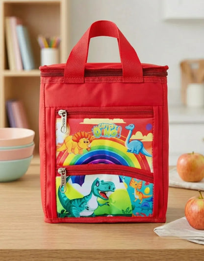 Red lunch bag with colorful dinosaur design on a wooden table