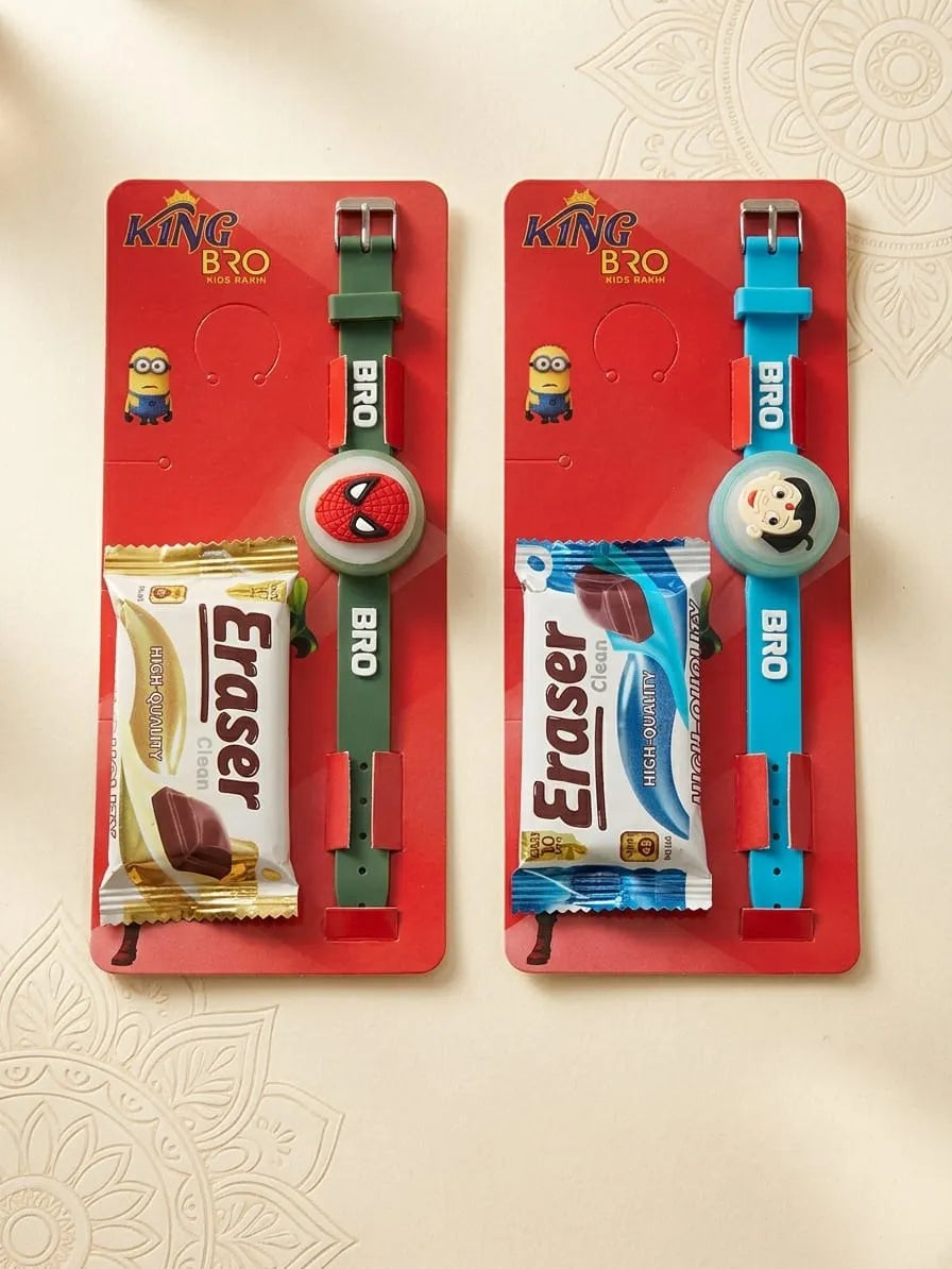 Two King Bro watch gift sets on red backing cards, each featuring a wristwatch and a packaged Eraser chocolate bar. One set has a green watch with a Spider-Man-themed dial, and the other has a blue watch with a cartoon character dial.
