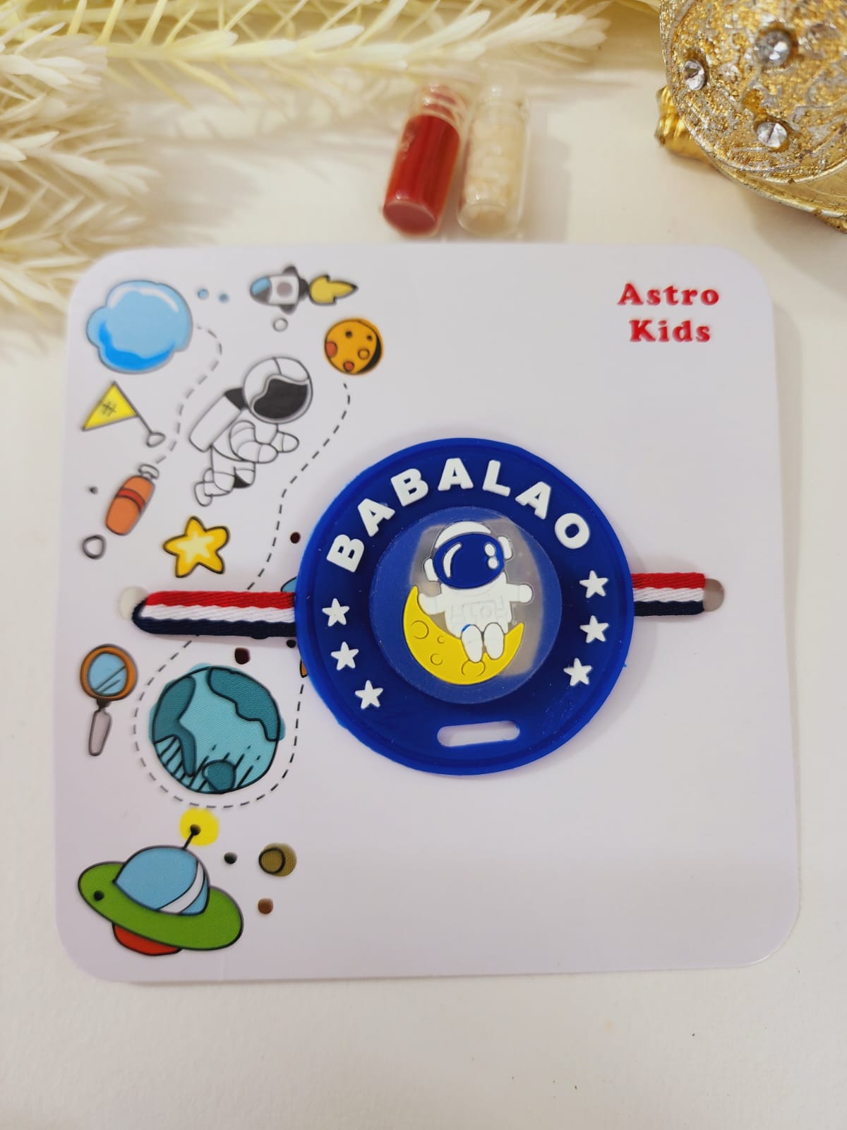 A card packed with a LED light displaying a space-themed design, intended for kids.