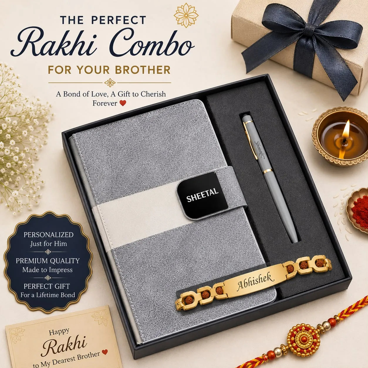 A personalized Rakhi gift set for a brother, presented in a black box. The set includes a gray textured paper notebook with a white band and a black nameplate reading 'SHEETAL', a gray ballpoint pen with gold trim, and a gold-plated brass Rakhi bracelet engraved with 'Abhishek'.
