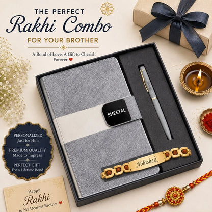 A personalized Rakhi gift set for a brother, presented in a black box. The set includes a gray textured paper notebook with a white band and a black nameplate reading 'SHEETAL', a gray ballpoint pen with gold trim, and a gold-plated brass Rakhi bracelet engraved with 'Abhishek'.