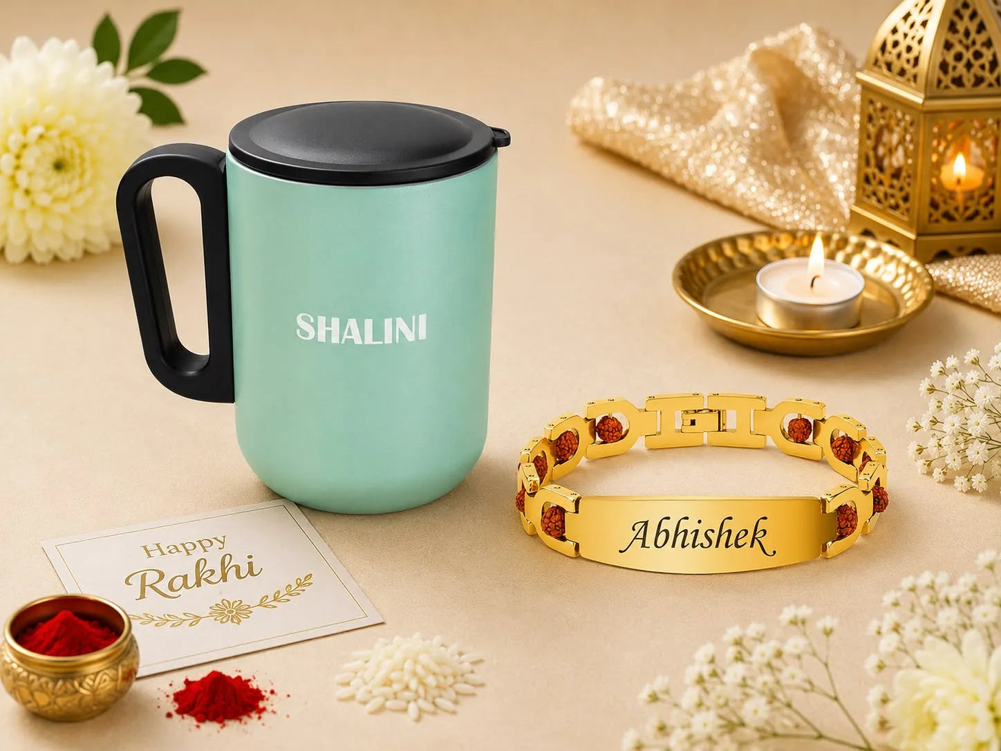 A festive gift arrangement featuring a mint green insulated mug with a black lid and handle, personalized with the name 'SHALINI' in white. Next to it is a gold-toned bracelet engraved with 'Abhishek' and accented with red stones.