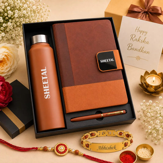 A Raksha Bandhan gift set in a black box, featuring a terracotta-colored SHEETAL insulated bottle, a brown and orange leather notebook with a matching pen, a gold Abhishek bracelet, and festive decorative elements on a beige background.