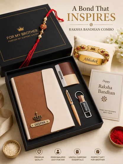 A Raksha Bandhan gift set arranged on a beige surface with a black presentation box, a brown and cream notebook, a gold bracelet, a black and gold pen, a keychain, a card, and a red tassel charm. Text on the image reads 'A Bond That INSPIRES Raksha Bandhan Combo'.