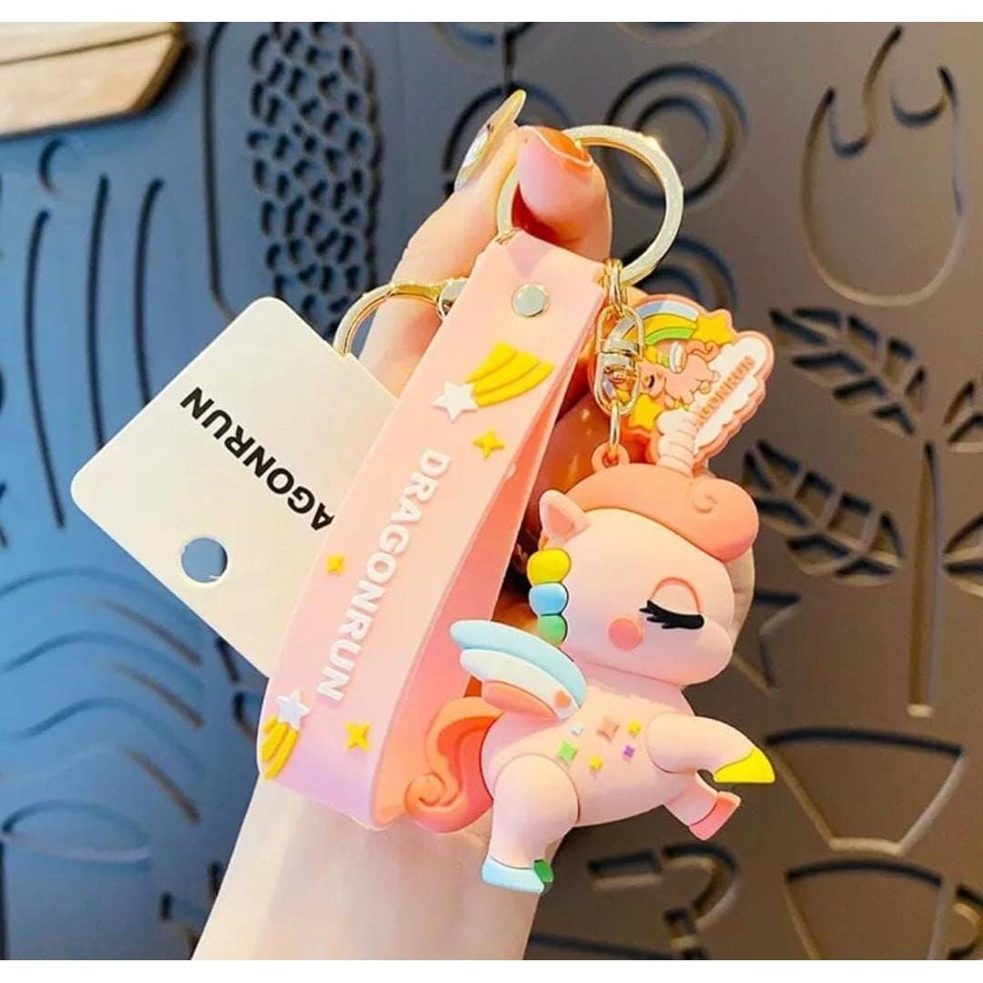 Pink cartoon character keychain with a visible brand tag on a decorative background