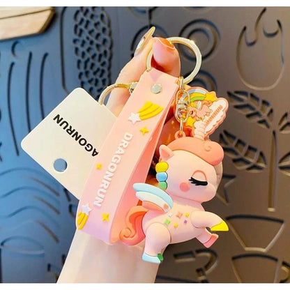 Pink cartoon character keychain with a visible brand tag on a decorative background