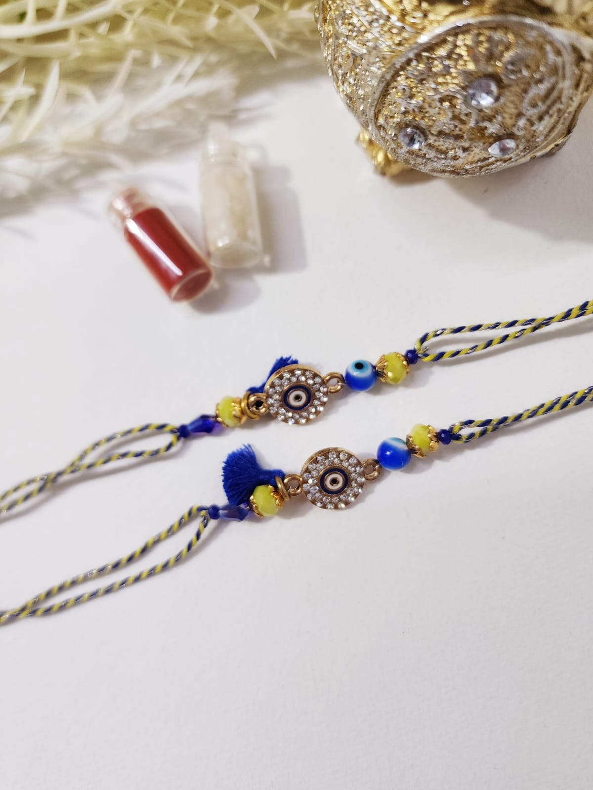 HOK Beautiful Evil Eye Blue-Yellow Rakhi