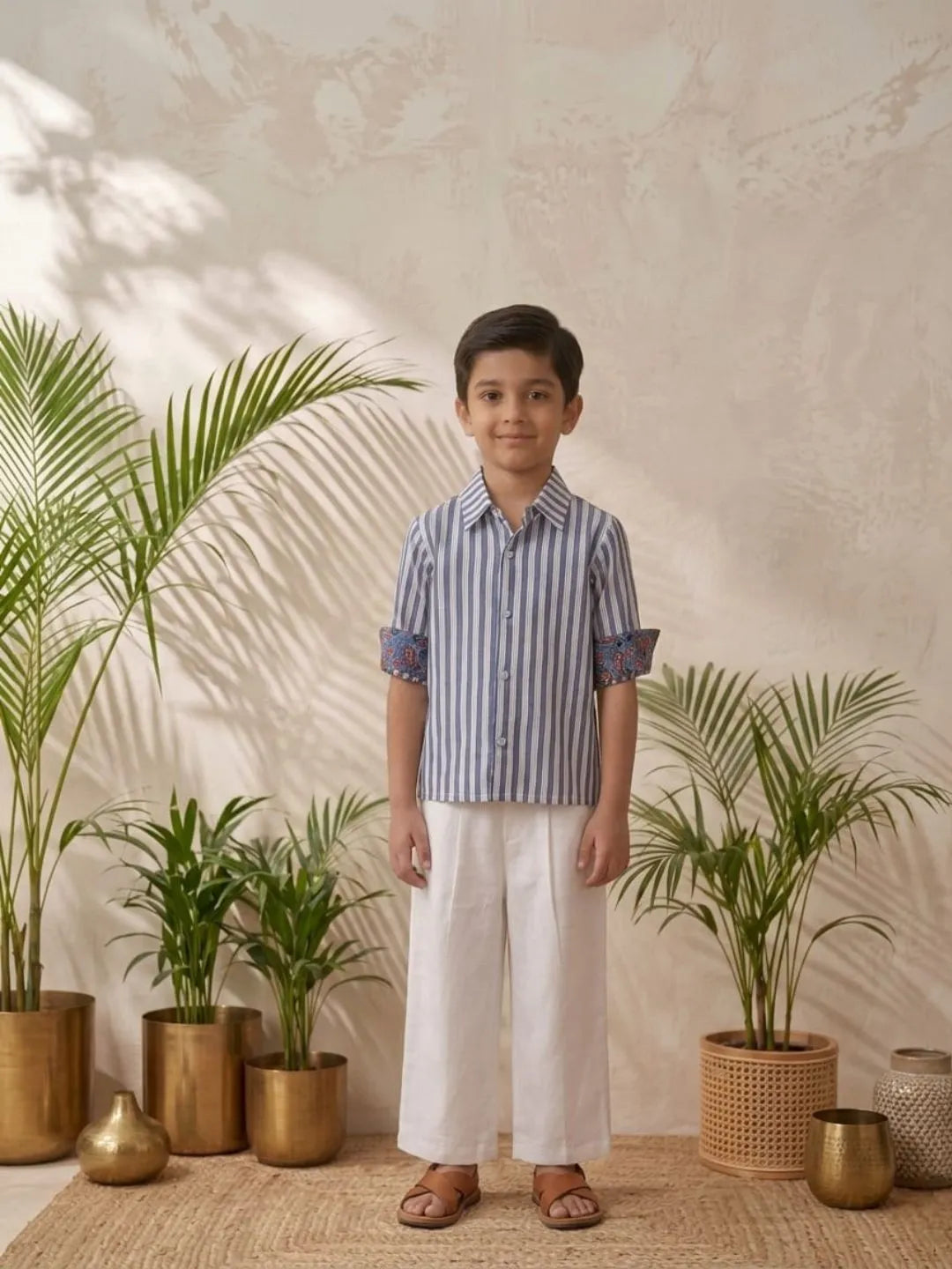 Boys blue striped cotton shirt with white trouser co-ord set front view