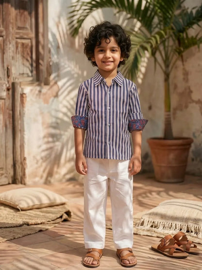 Kids blue stripe shirt and white pants outfit front angle