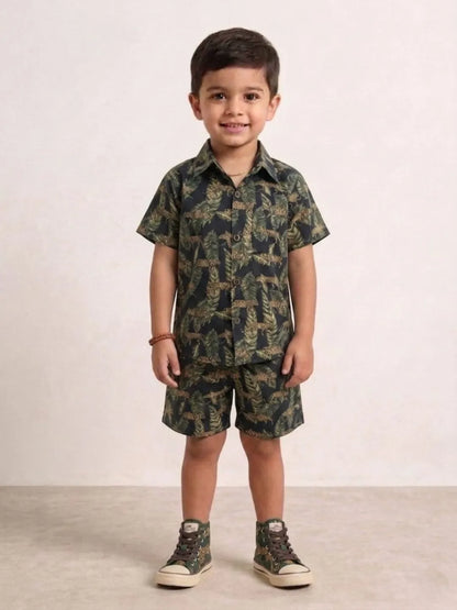 Child wearing a camouflage outfit with a shirt and shorts on a plain background