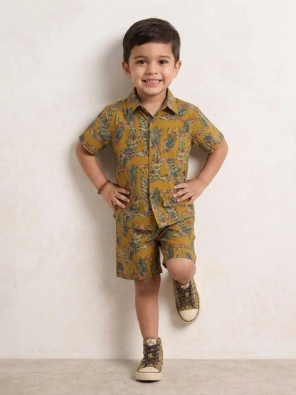 Child wearing a patterned outfit with a plain background