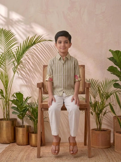 Boys olive striped cotton shirt with white trouser co-ord set sitting pose summer outfit