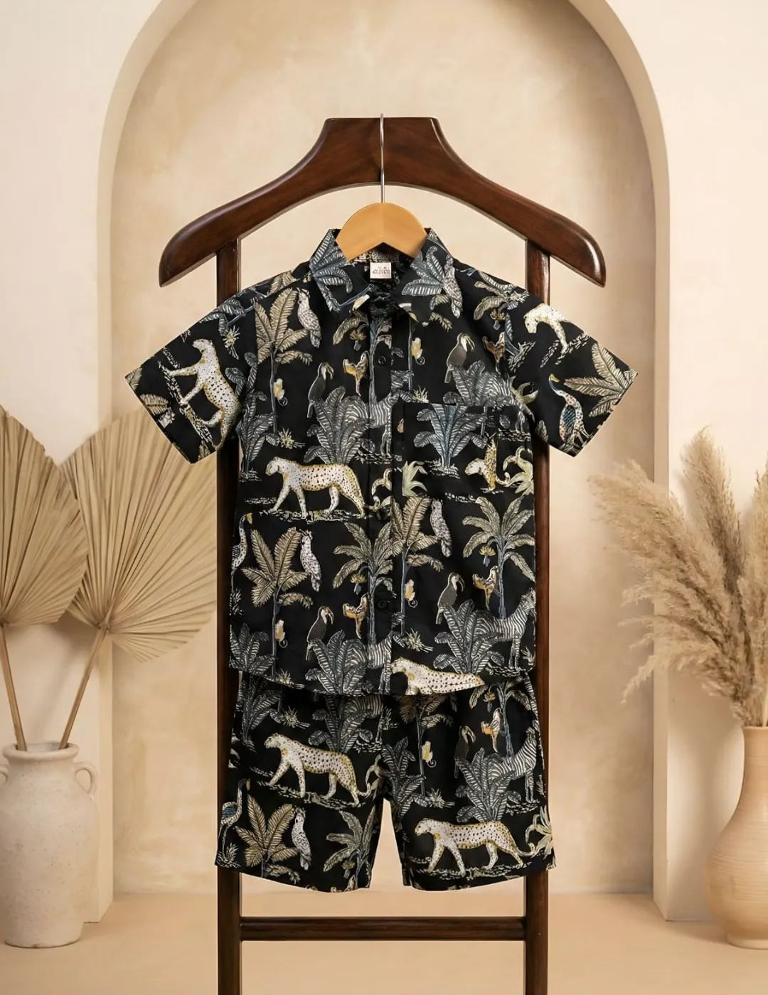 Kids black co-ord set with jungle print front view
