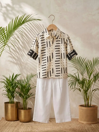 Premium boys white abstract print cotton shirt and white trouser co-ord set front pose
