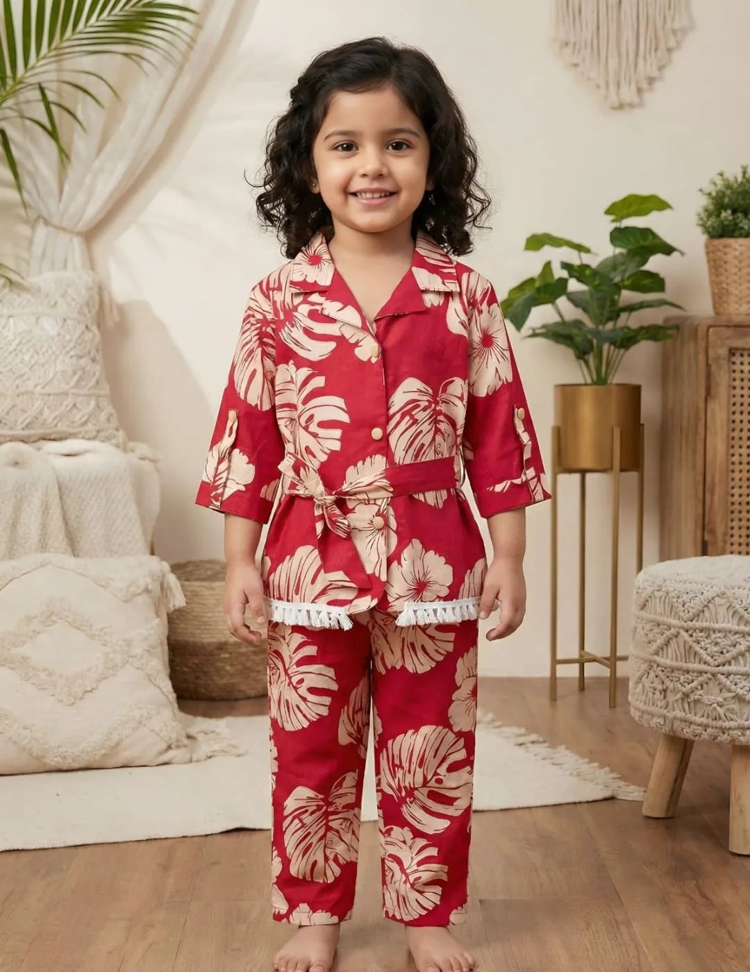 Girl wearing red floral co-ord set with shirt top and matching pants