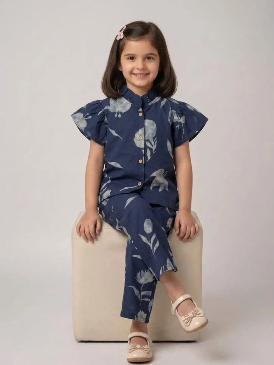 Girl sitting in blue floral cotton co-ord set for casual summer wear
