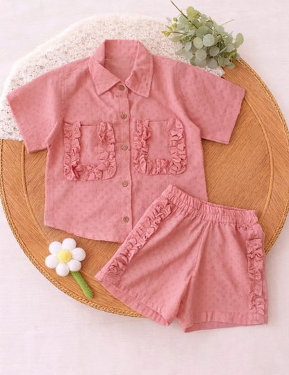 Girls shirt and shorts co-ord set flat lay clothing image