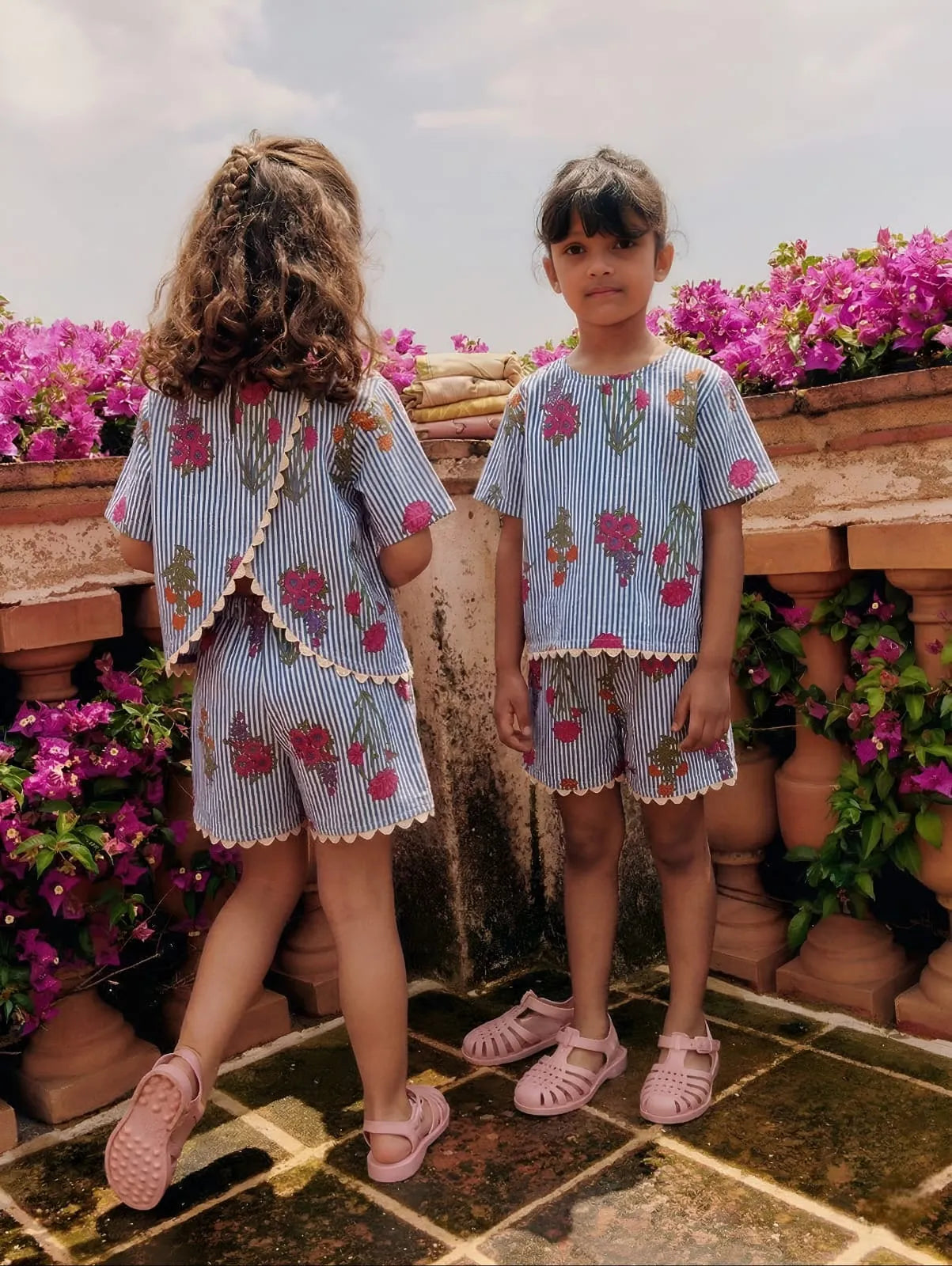 Girls cotton co-ord set with floral print and stripe pattern, front and back view, breathable summer outfit with lace detail and split back design