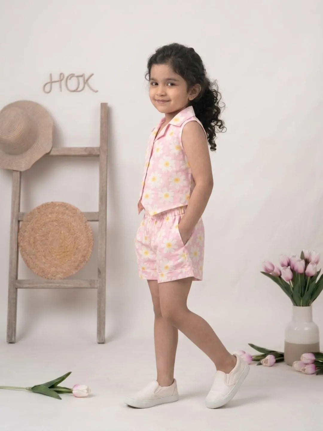 Side angle of girls co-ord set with sleeveless shirt and shorts