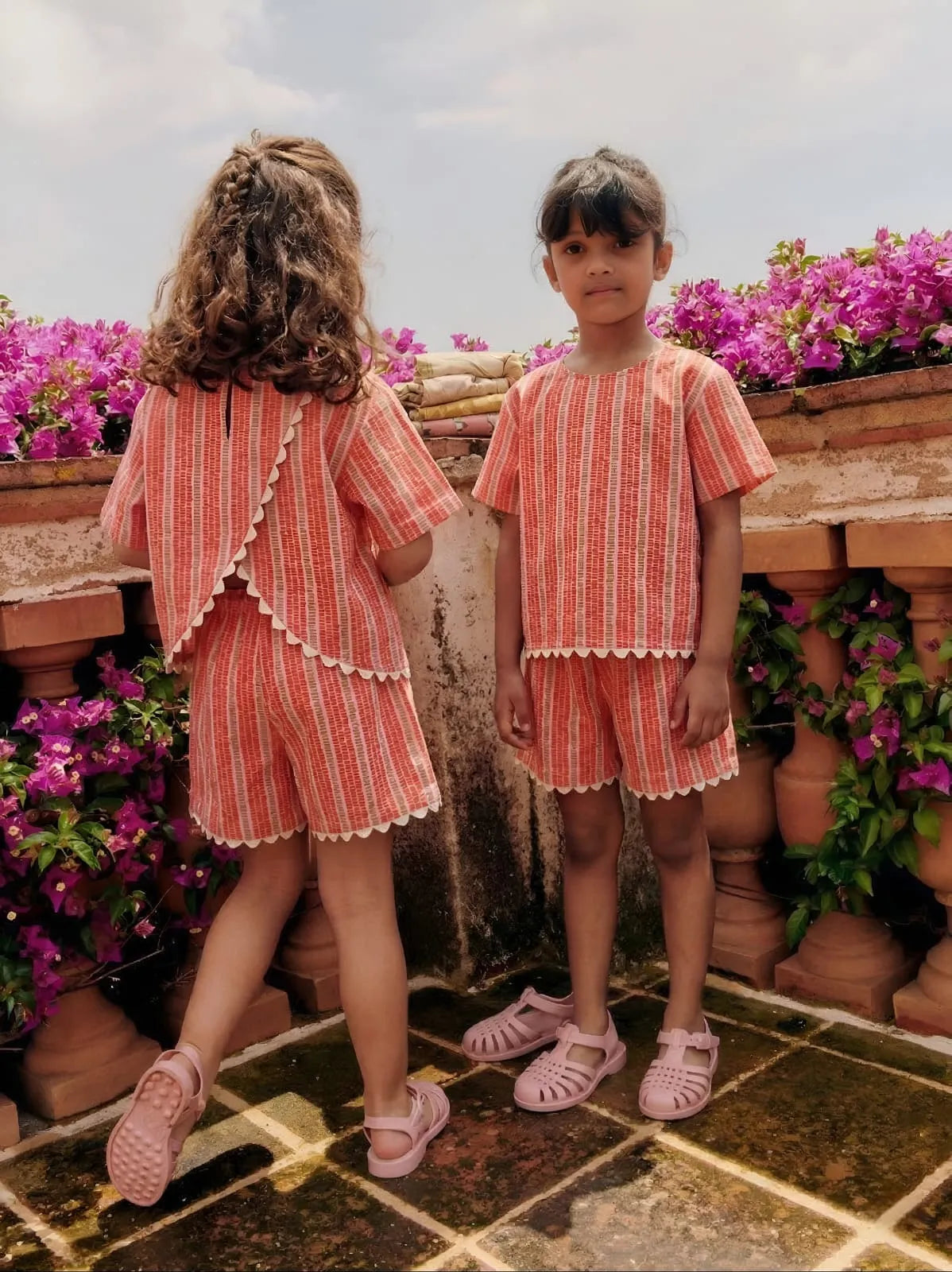 Girls cotton co-ord set with striped pattern, front and back view, lightweight summer outfit with crochet lace trim and overlap back design