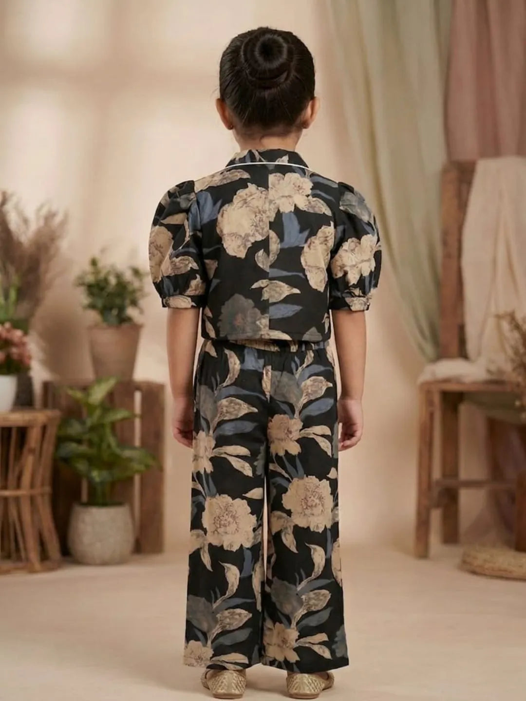 Back view of girls black floral co-ord set with collared top and matching pants