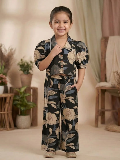 Front look of girls black floral printed co-ord set with stylish crop top and matching pants