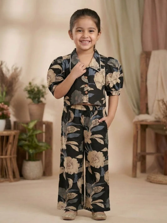 Front look of girls black floral printed co-ord set with stylish crop top and matching pants