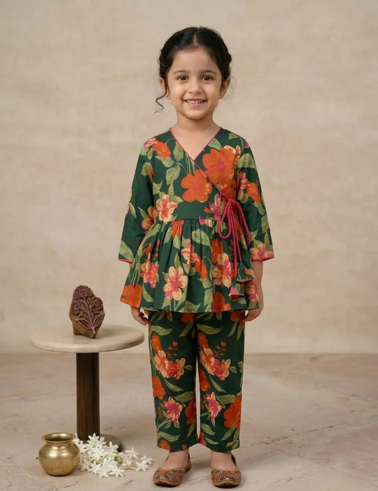 girl wearing green floral wrap co-ord set front view top and pants