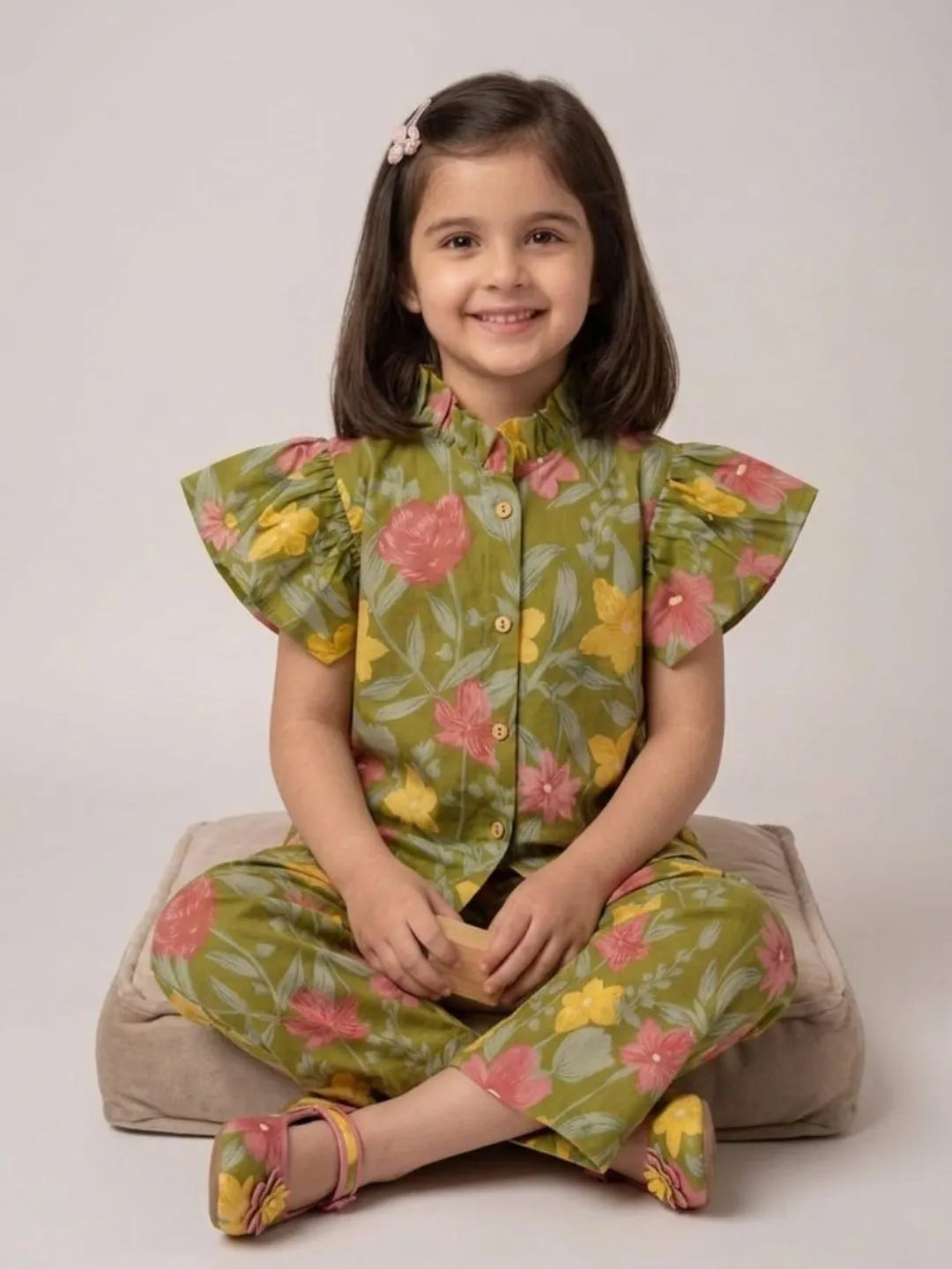 Girl sitting in green floral cotton co-ord set for casual wear and vacations